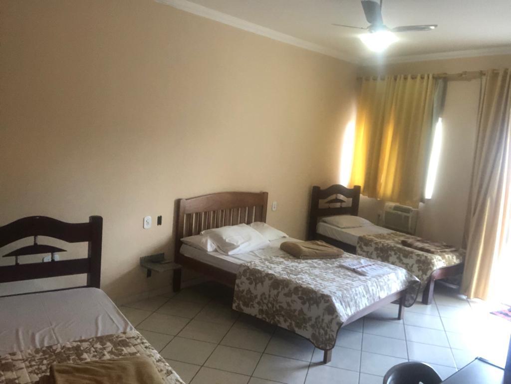 Quarto duplo com camas de solteiro
